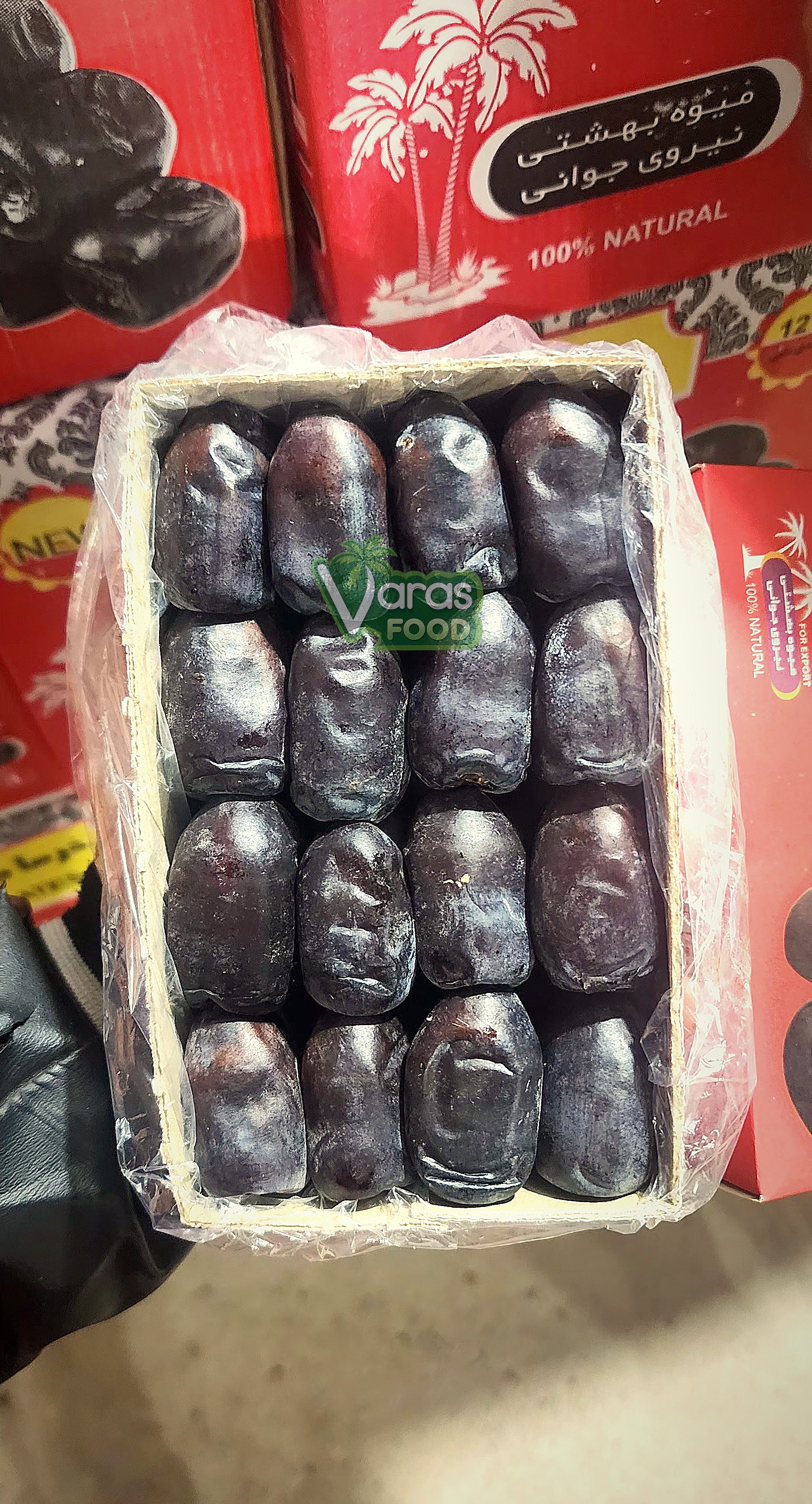 Cartons of VARAS Food Mazafati dates stacked and ready inside an export truck
